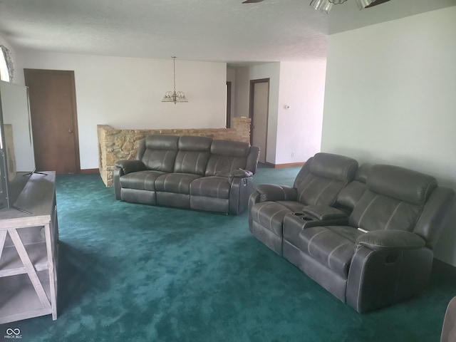 living room with a chandelier and dark colored carpet