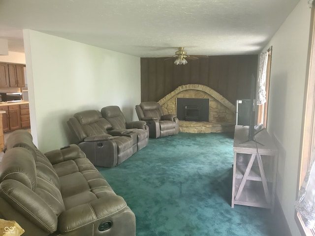 living room featuring ceiling fan and dark carpet