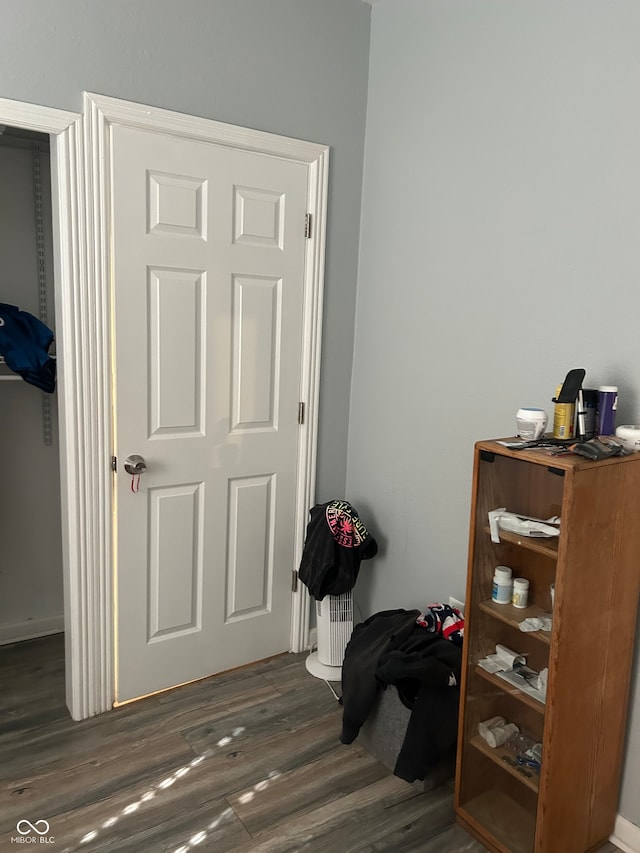 bedroom featuring dark hardwood / wood-style flooring