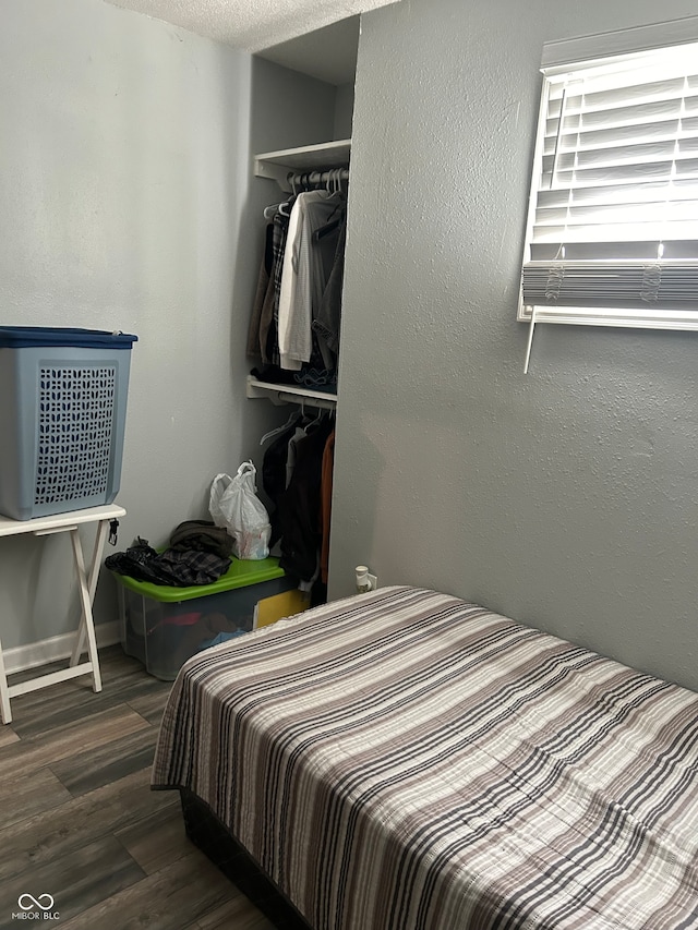 bedroom featuring dark wood-type flooring