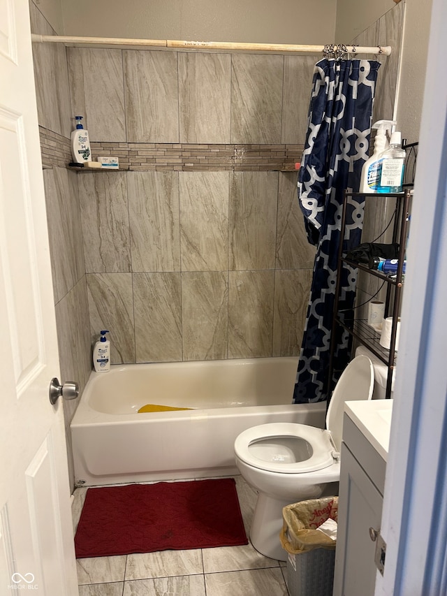 full bathroom with vanity, shower / bath combo with shower curtain, and toilet