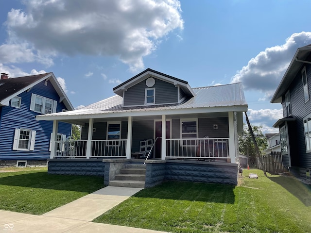 view of front facade with a porch and a front yard