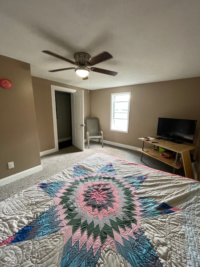 interior space featuring light carpet, a textured ceiling, and ceiling fan