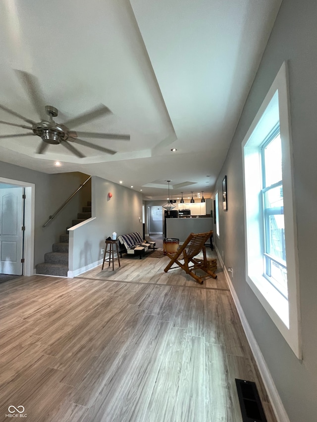 interior space featuring light hardwood / wood-style floors and ceiling fan