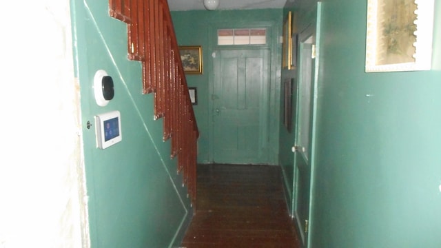 corridor featuring dark wood-type flooring