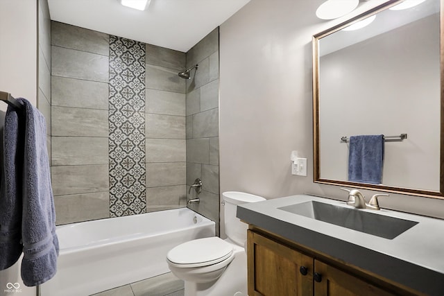 full bathroom featuring vanity, toilet, tile patterned flooring, and tiled shower / bath