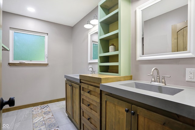 bathroom with vanity and tile patterned flooring