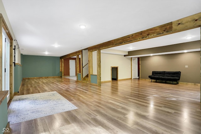 unfurnished living room featuring light wood-type flooring