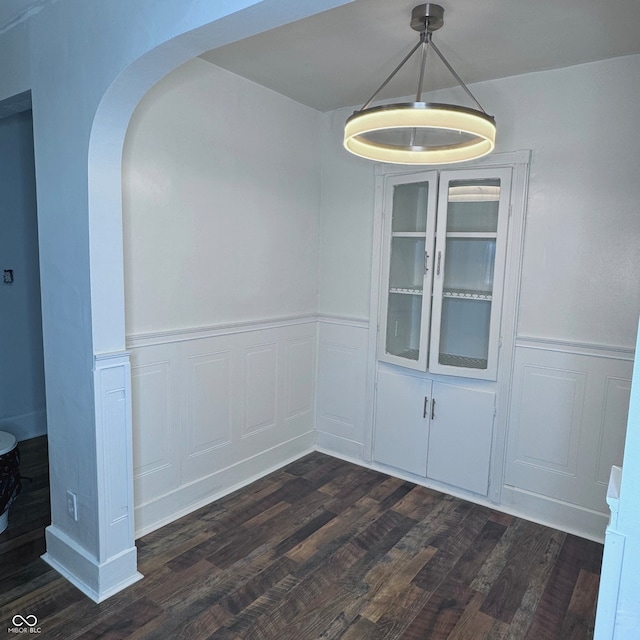 unfurnished room featuring dark hardwood / wood-style flooring