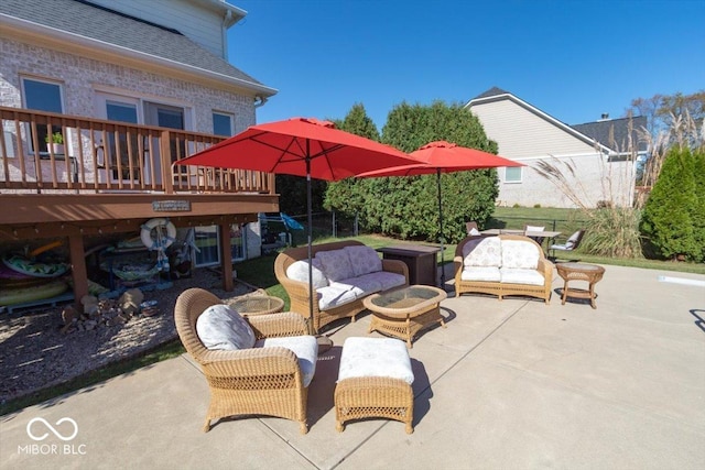 view of patio with an outdoor living space and a deck