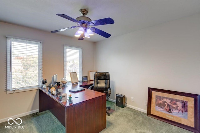 home office with baseboards, a ceiling fan, and carpet flooring