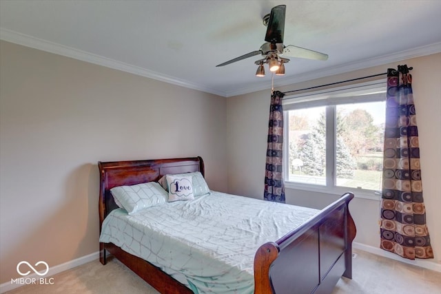 bedroom featuring ornamental molding, light colored carpet, and ceiling fan