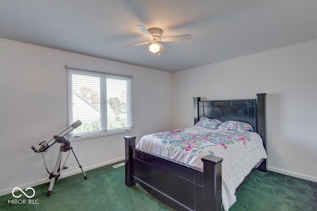 carpeted bedroom featuring a ceiling fan and baseboards
