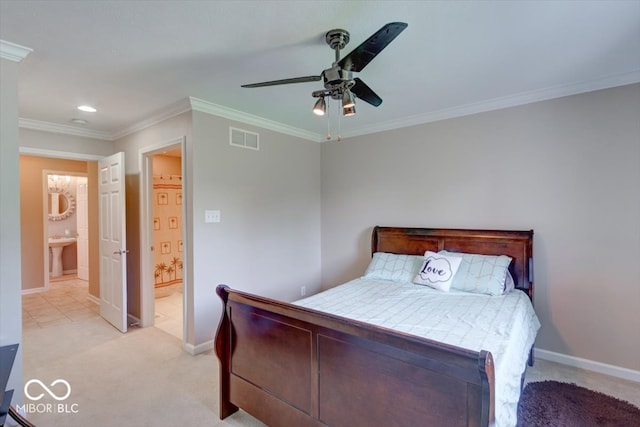 carpeted bedroom with ceiling fan, ensuite bath, sink, and crown molding