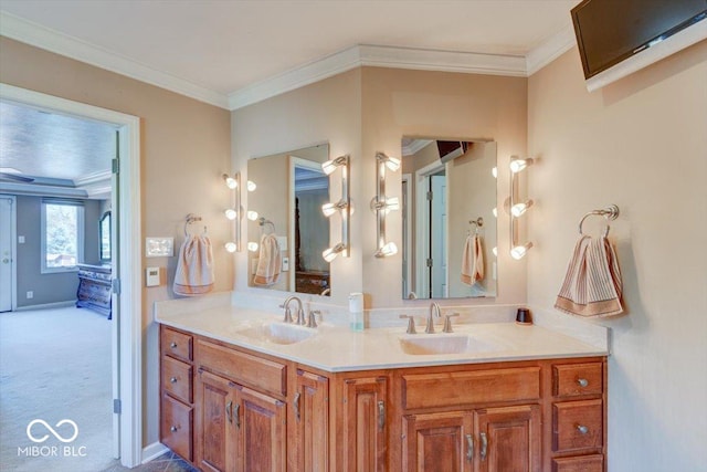 full bath featuring ornamental molding, a sink, and double vanity