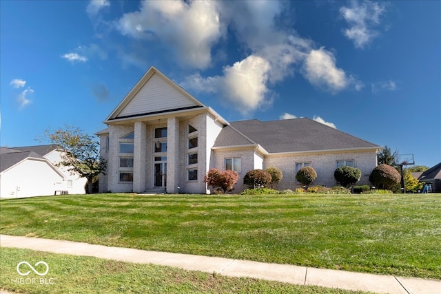 greek revival house featuring a front lawn