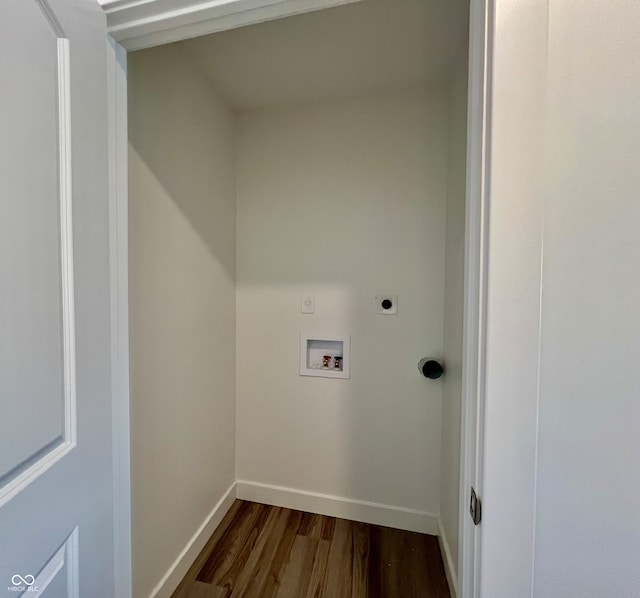 laundry room featuring hookup for a washing machine, dark hardwood / wood-style flooring, and electric dryer hookup