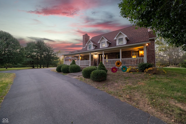 cape cod house with covered porch