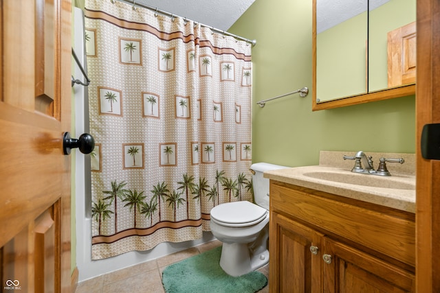 bathroom featuring tile patterned floors, toilet, a shower with shower curtain, vanity, and a textured ceiling