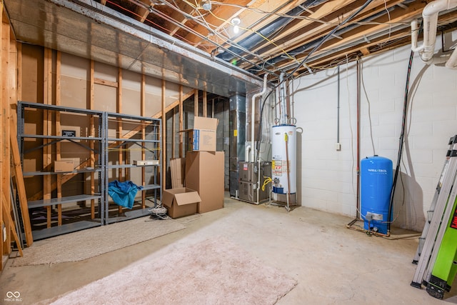 basement featuring water heater and heating unit