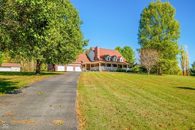 view of front of home featuring a front lawn and a garage