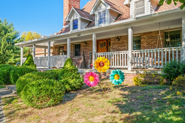 cape cod home with a porch