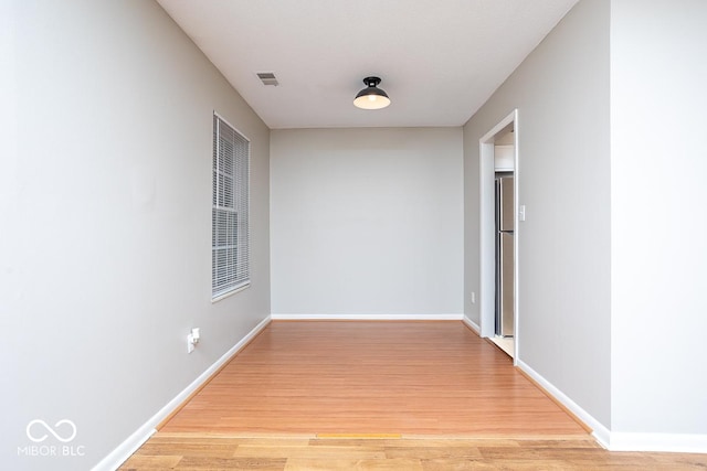 corridor featuring light hardwood / wood-style floors