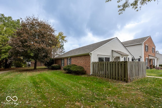 view of home's exterior with a lawn