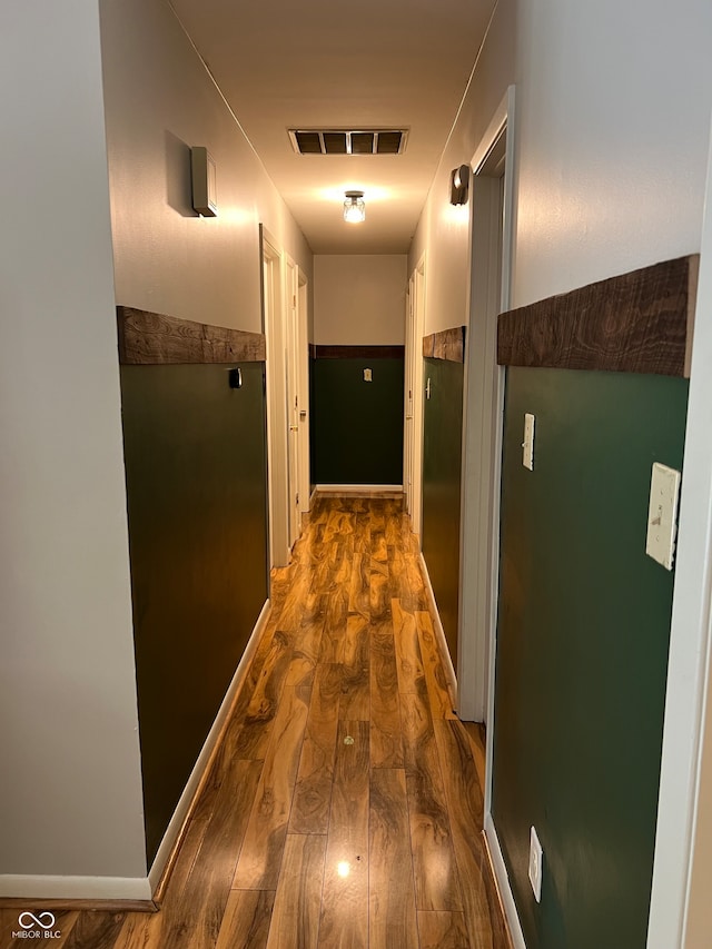 corridor with dark wood-type flooring