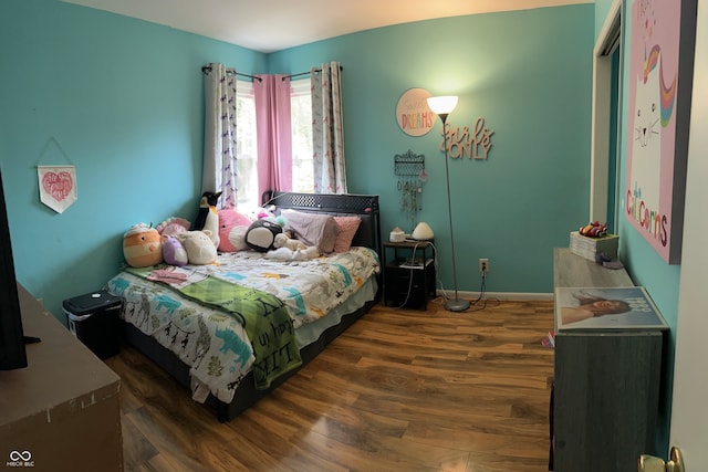 bedroom featuring dark hardwood / wood-style flooring