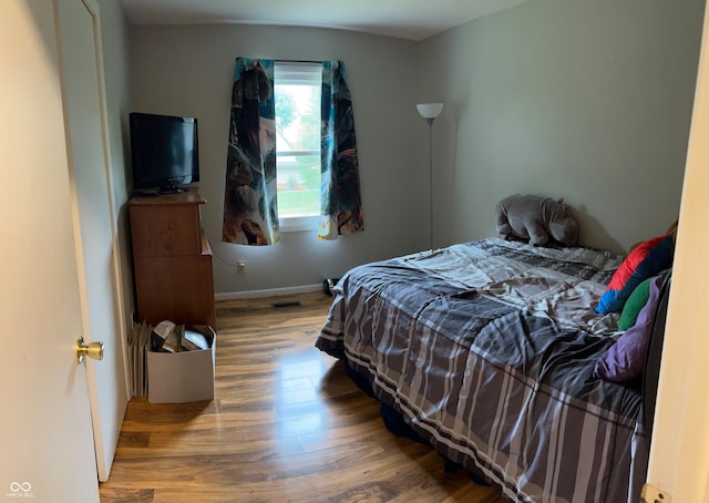 bedroom featuring wood-type flooring