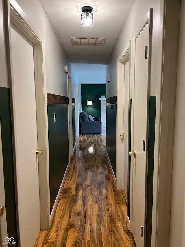 hallway featuring dark hardwood / wood-style flooring