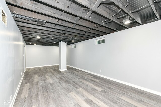 basement featuring hardwood / wood-style flooring