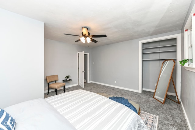 carpeted bedroom with a textured ceiling and ceiling fan