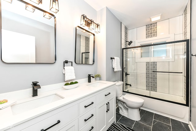 full bathroom with vanity, toilet, and enclosed tub / shower combo