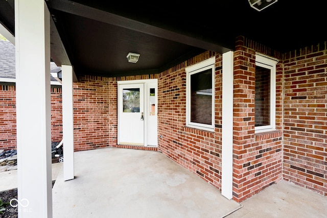 property entrance with a patio