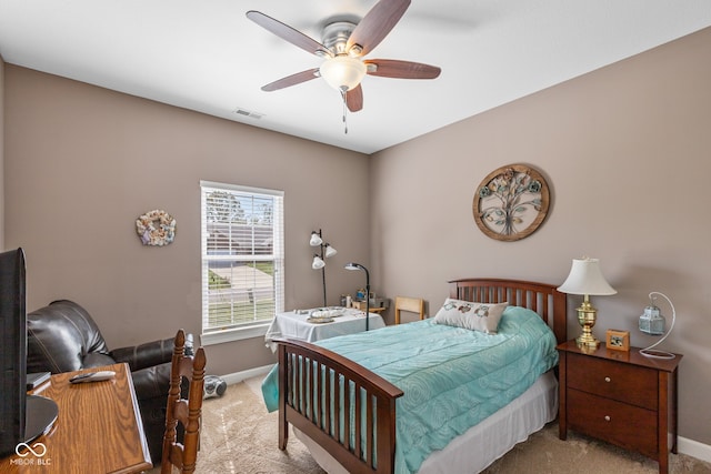 bedroom with light colored carpet and ceiling fan