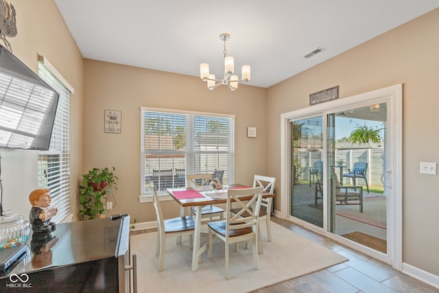 dining area featuring a notable chandelier