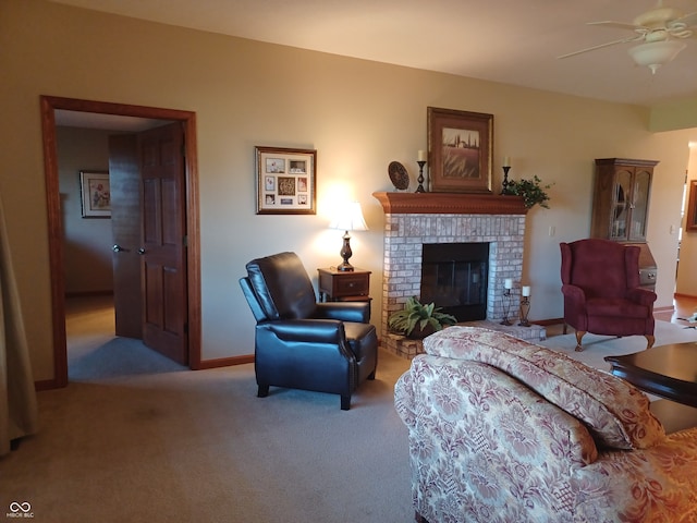 carpeted living room with a fireplace and ceiling fan