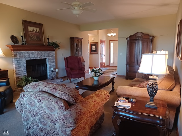 carpeted living room with ceiling fan with notable chandelier and a fireplace