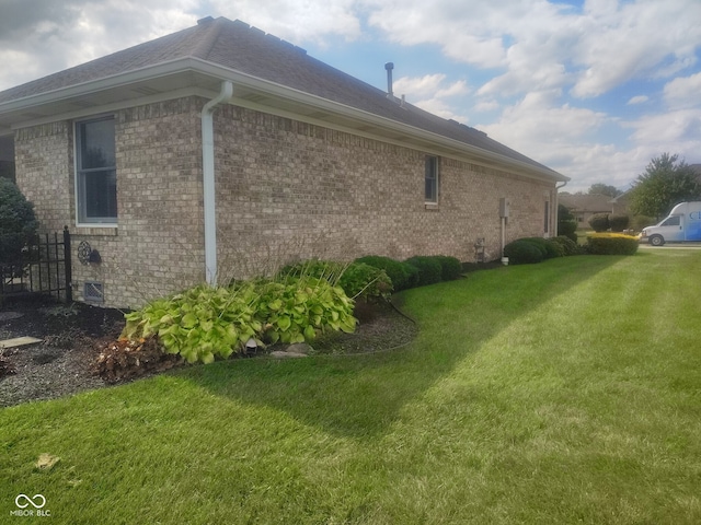 view of property exterior featuring a lawn