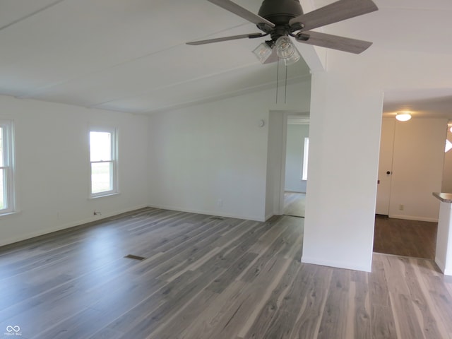 unfurnished room with ceiling fan and hardwood / wood-style flooring