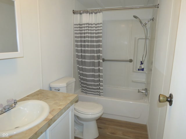 full bathroom featuring vanity, hardwood / wood-style floors, shower / bath combination with curtain, and toilet