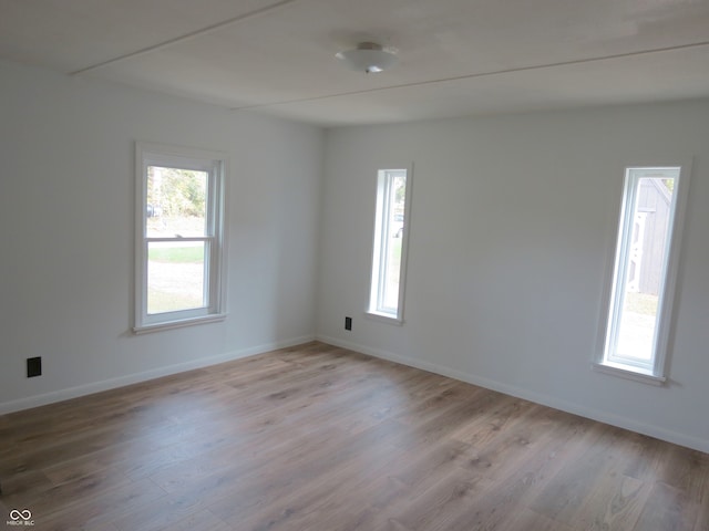 spare room featuring light hardwood / wood-style floors