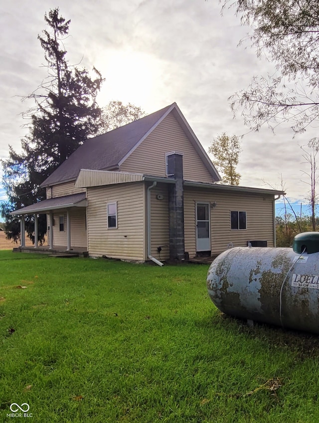 view of side of home featuring a yard