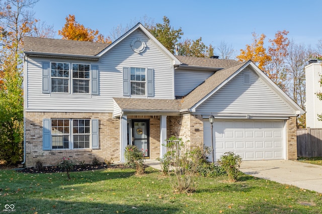 front facade with a front yard and a garage