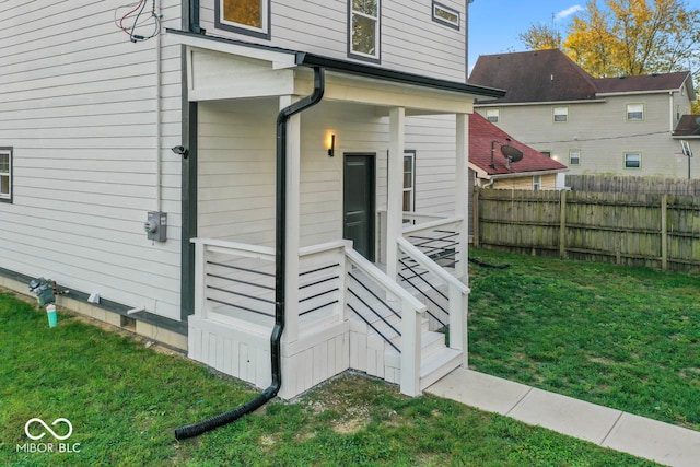 view of side of home with a lawn