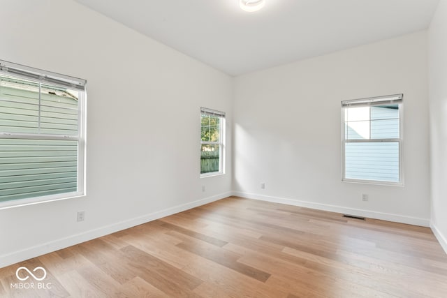 empty room with light wood-type flooring