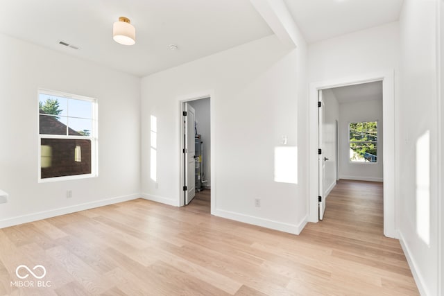 empty room with light hardwood / wood-style floors