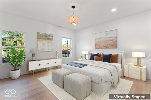 bedroom featuring light hardwood / wood-style flooring